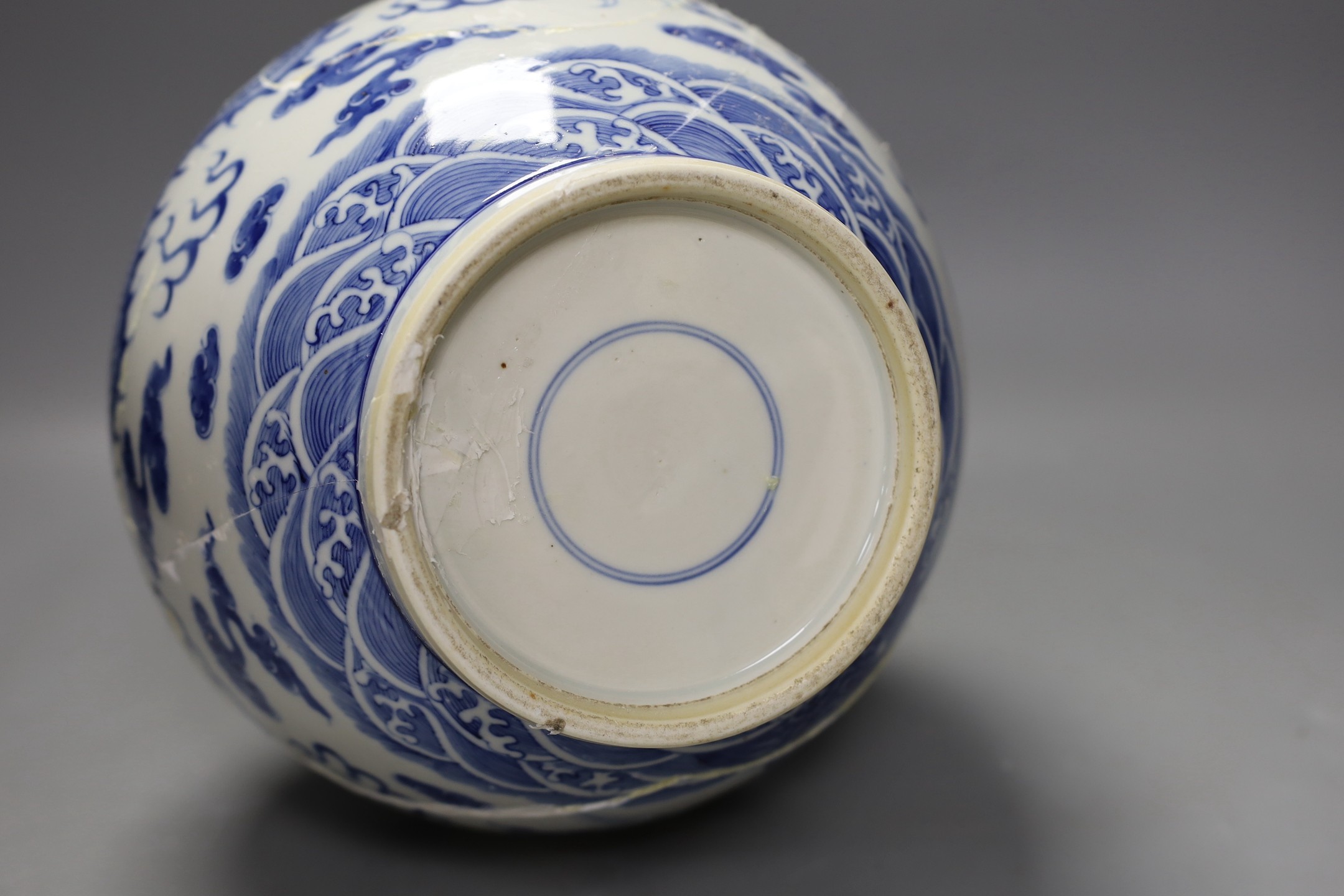 A large Chinese blue and white vase, damaged, 38cm